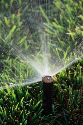 Lawn sprinkler service by Rowe Landscape Installation, LLC.